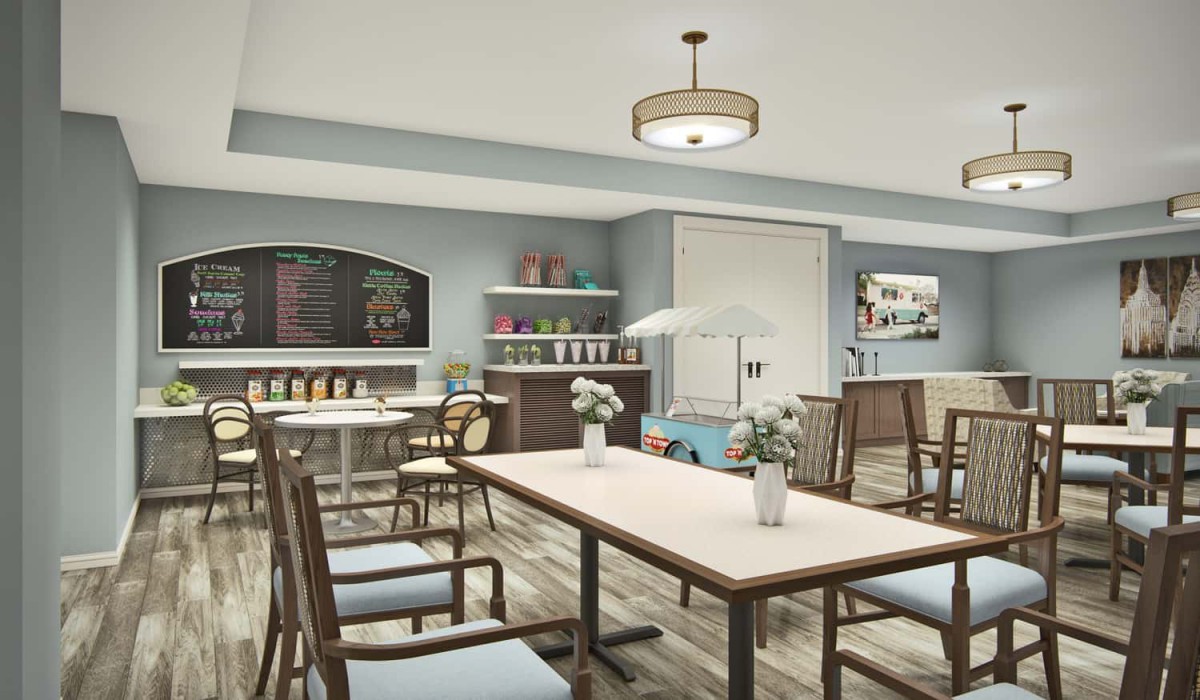 A modern cafe interior with tables, chairs, and decorative shelves.