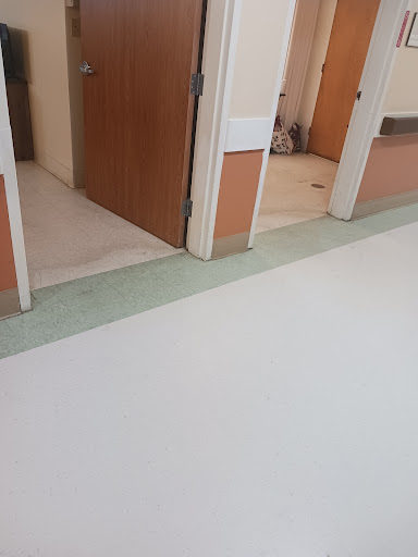 A view of a clean hallway with multiple doors.