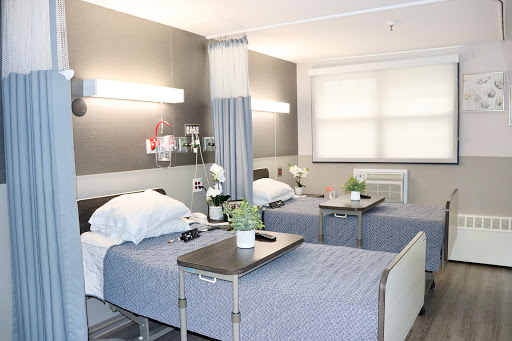 A well-equipped patient room in a modern hospital.