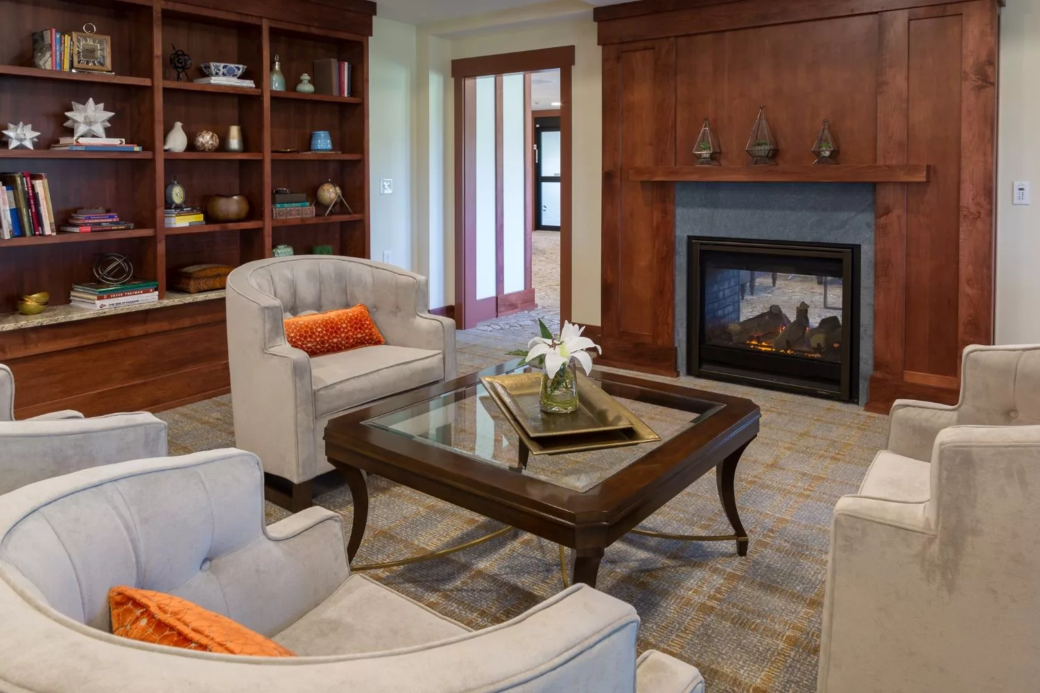 Cozy living room with a fireplace and elegant furniture.