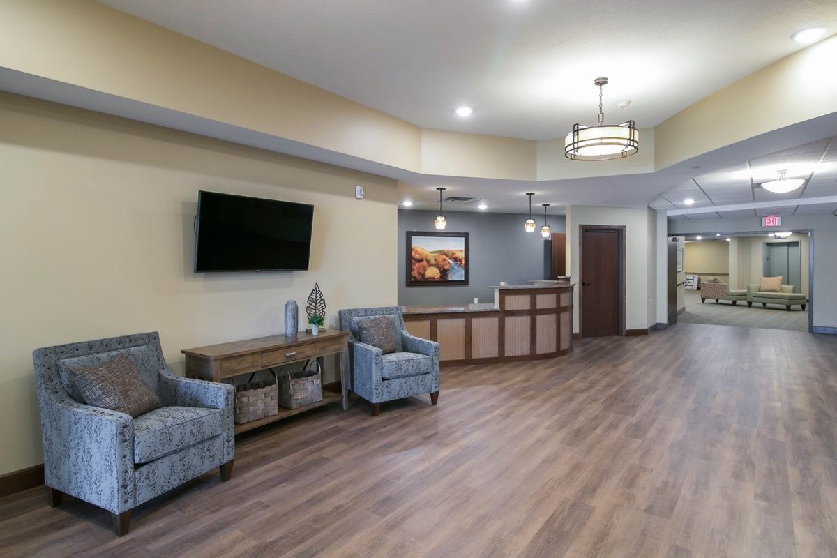 A stylish lobby with comfortable seating and a reception desk.