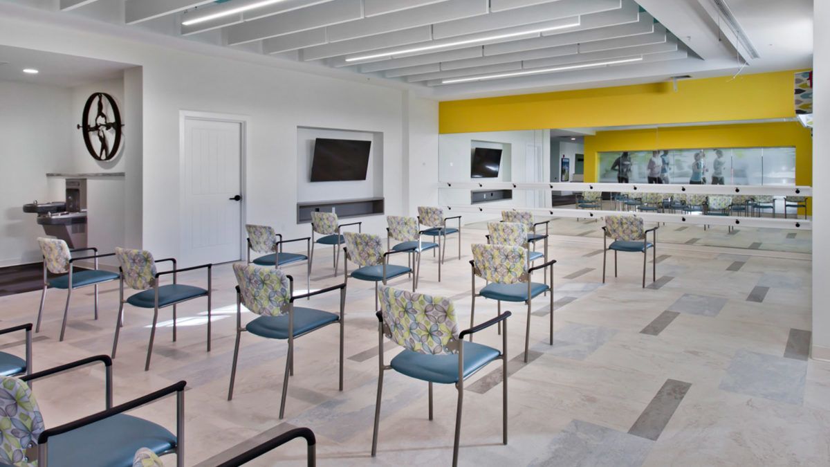 A modern classroom with arranged chairs and a bright interior.