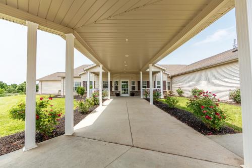 A welcoming entrance with a spacious walkway and well-maintained landscaping.