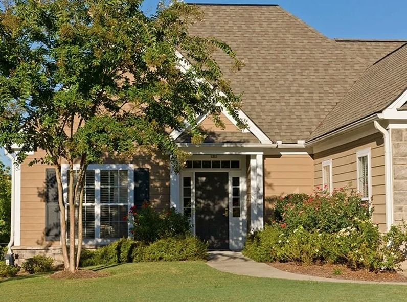 A charming suburban house with a well-maintained front yard and inviting entrance.