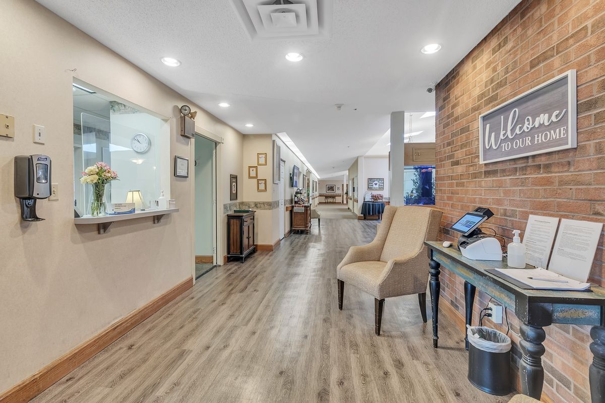 A modern office waiting area with comfortable seating and sleek design elements.