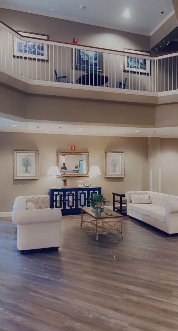 A stylish and modern living room with elegant furniture and decor.