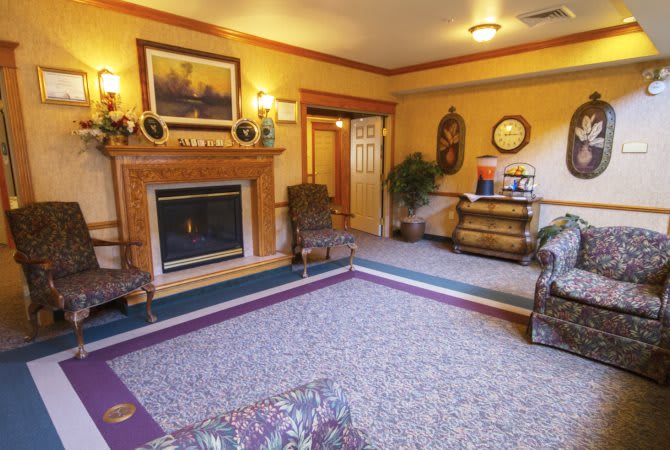 A cozy living room with a fireplace and elegant decor.