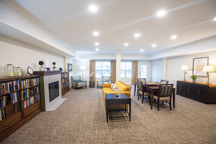 A spacious and modern living room featuring comfortable furniture and a cozy dining area.