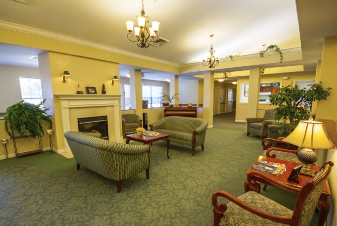 A cozy living room with comfortable seating and a fireplace.