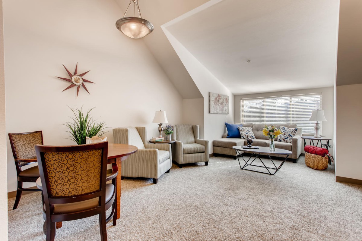 A cozy living room with modern furnishings and ample natural light.