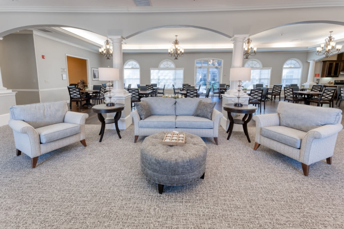 A modern living room with elegant furniture and soothing decor.