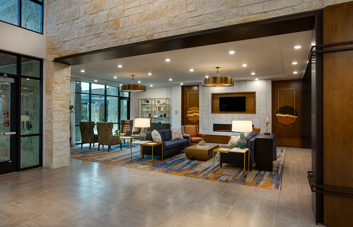 A modern living room with contemporary furniture and elegant lighting.