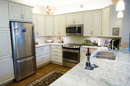 A modern kitchen featuring sleek appliances and a stylish marble countertop.