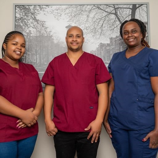 A group of medical professionals posing for a team portrait in their scrubs.