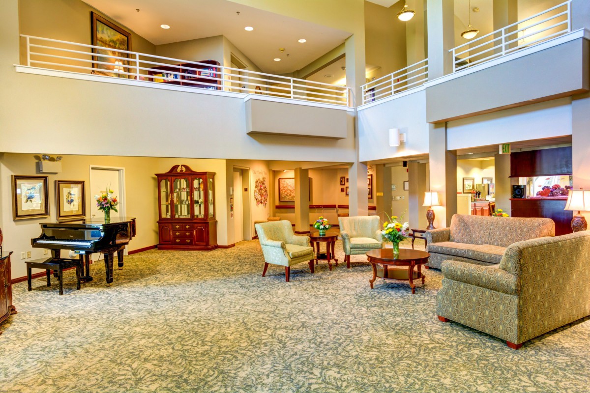 A spacious and elegantly designed lobby with comfortable seating and warm lighting.