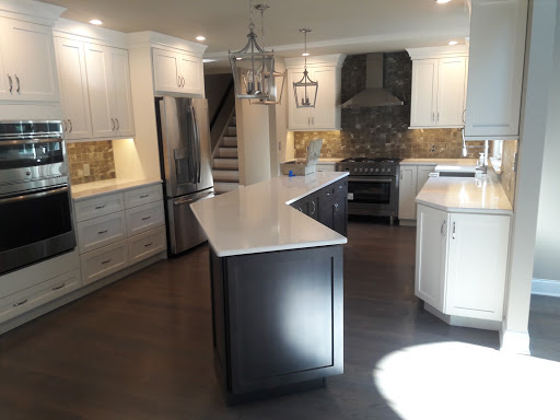 A beautifully designed modern kitchen showcasing an open layout with a central island and elegant cabinetry.