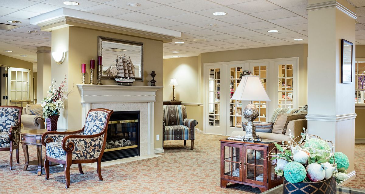 A cozy living room with a fireplace and elegant furniture.