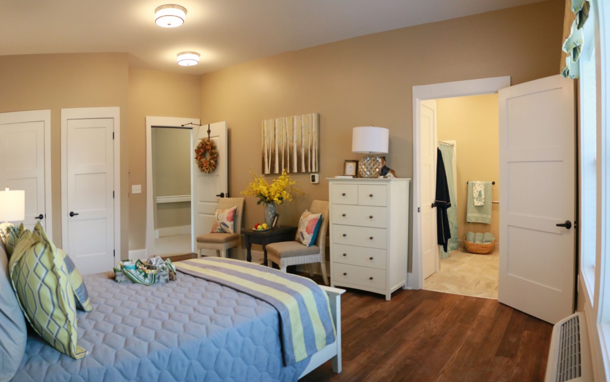 Cozy bedroom with modern decor and furniture.