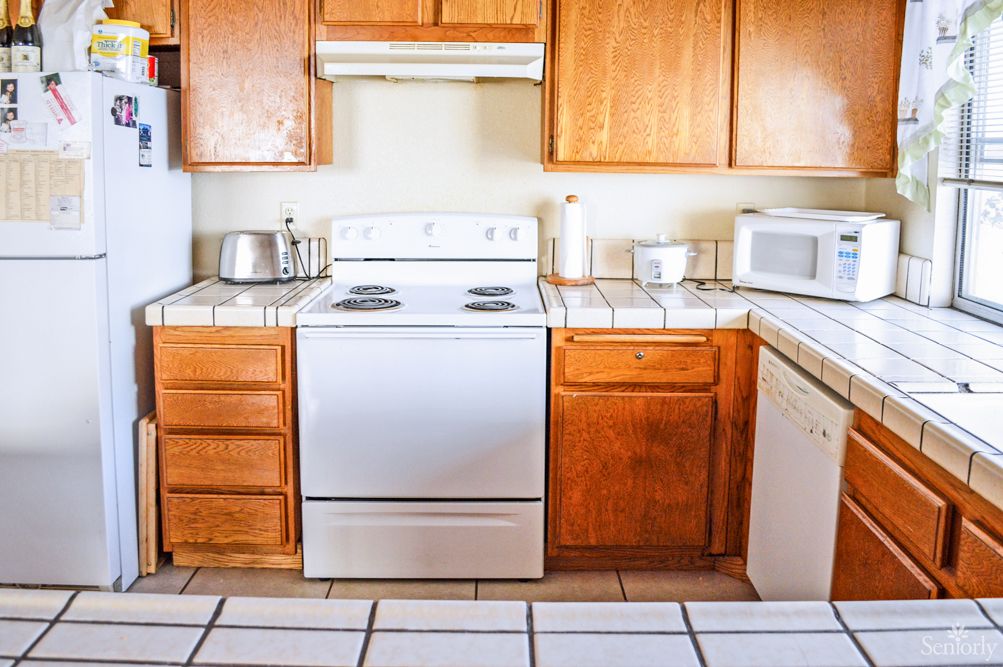 A well-organized kitchen with wooden cabinets and modern appliances.