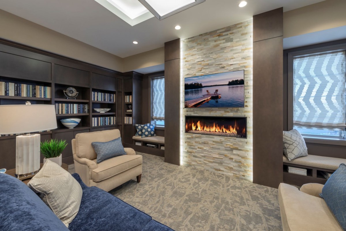 A modern living room with a cozy fireplace and stylish decor.