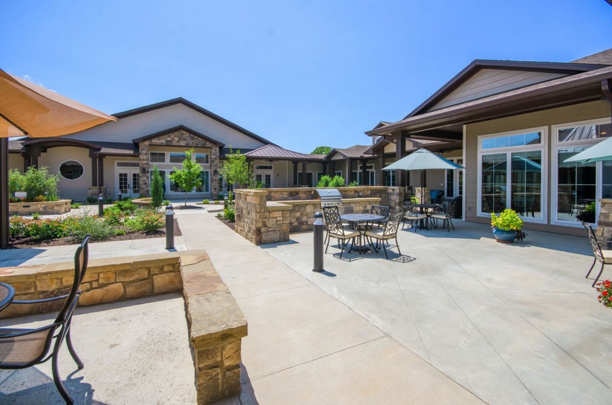 A well-designed courtyard with outdoor seating on a sunny day.