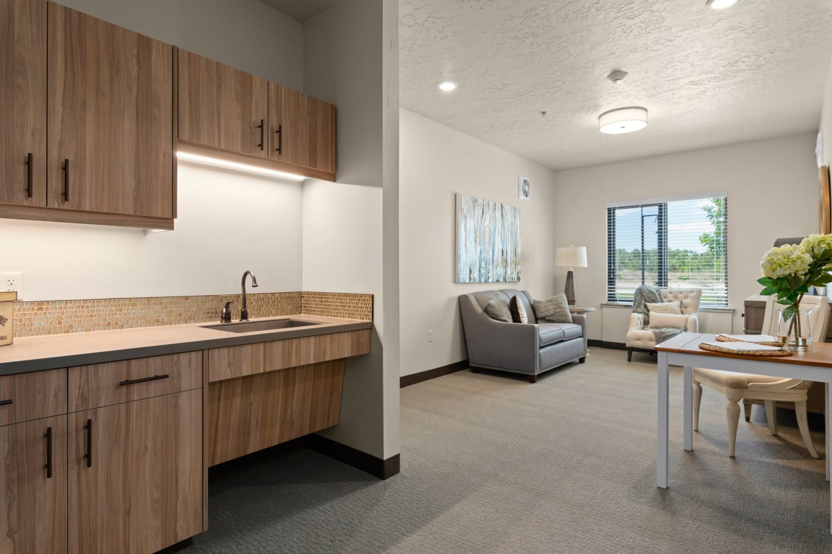 Modern apartment interior featuring a kitchenette and cozy living area.