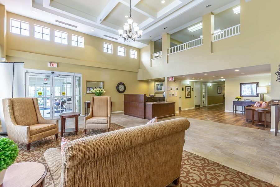 A bright and spacious lobby area with comfortable seating and a welcoming reception desk.