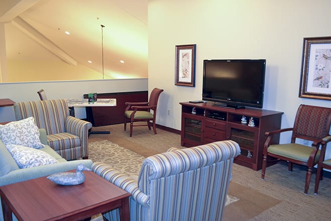 A cozy living room with comfortable seating and a television.