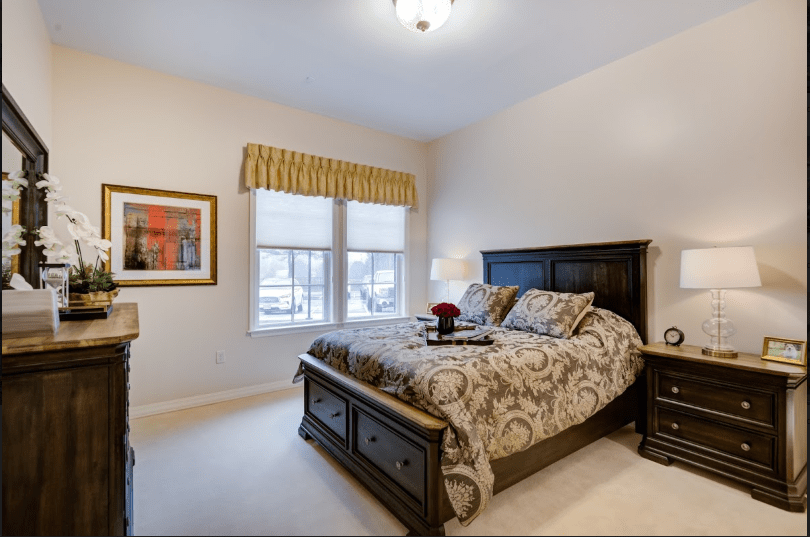A cozy bedroom with a large bed and elegant decor.