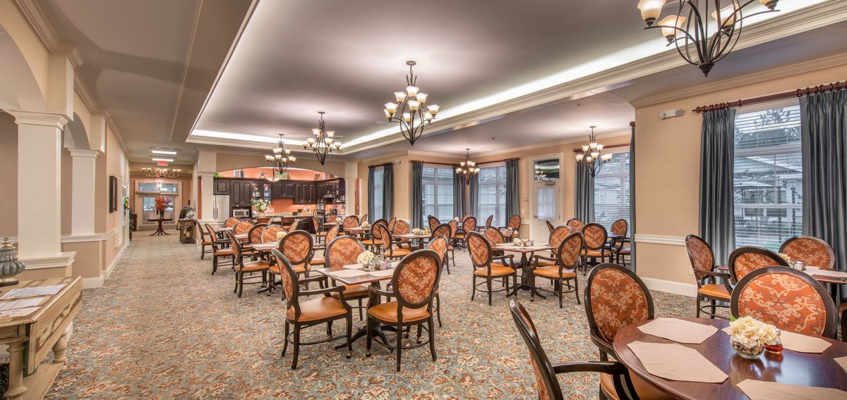 A well-lit dining room with elegant seating and decor.