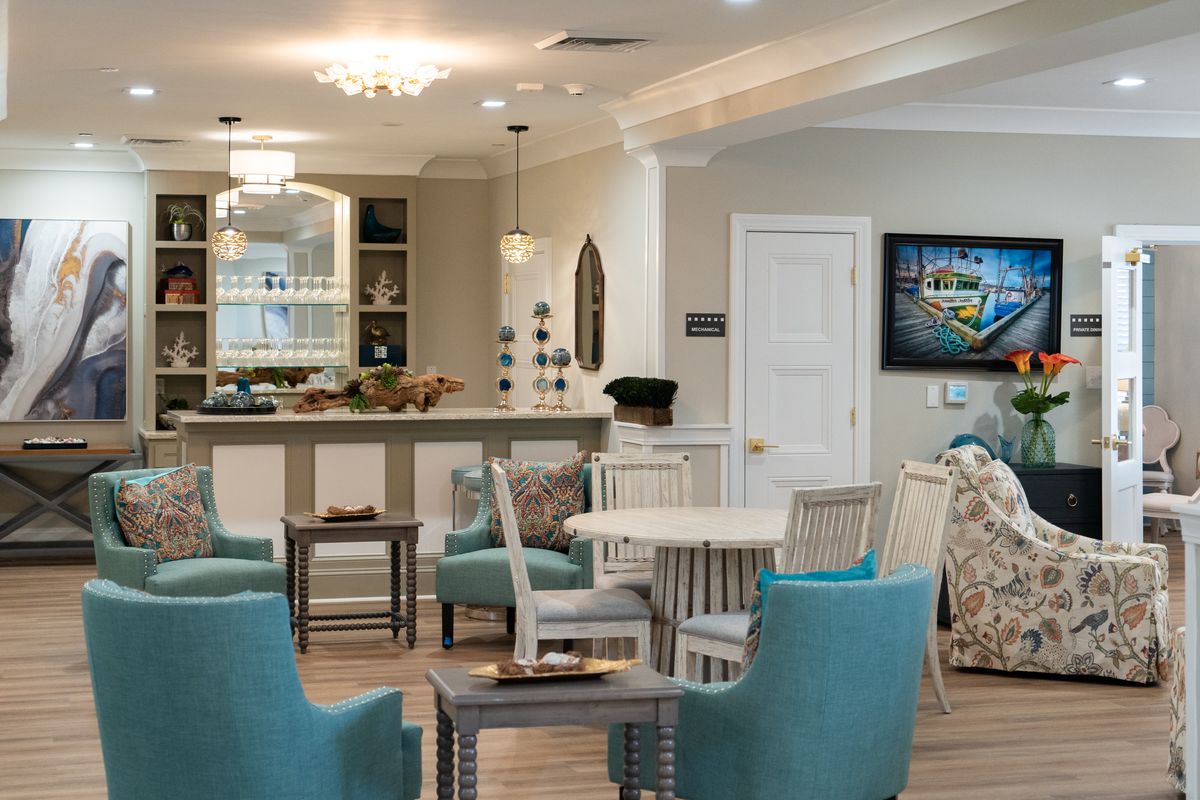 A modern living room with comfortable seating and elegant decor.