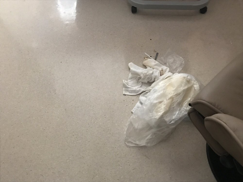 Discarded gloves on a clean indoor floor.