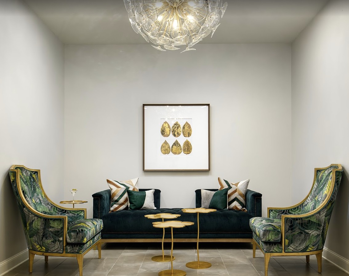 A luxurious living room with elegant furniture, modern lighting, and sophisticated artwork.