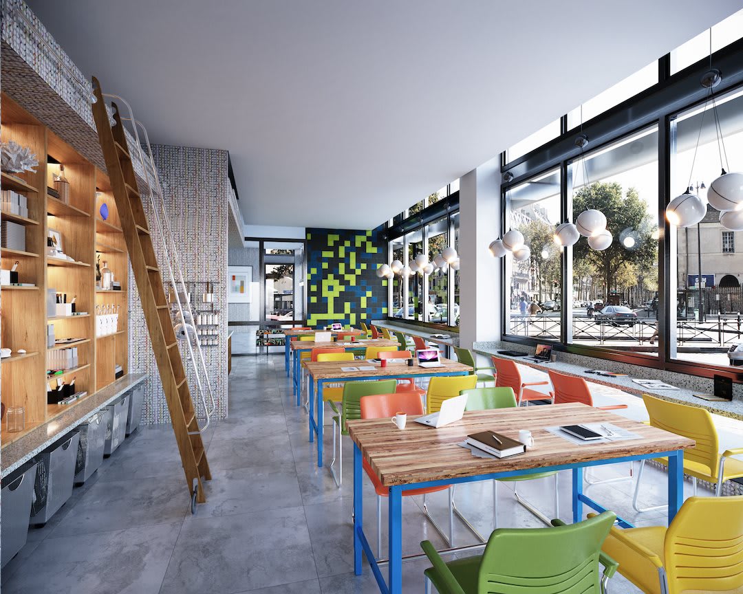 A modern cafe interior with colorful chairs and ample natural light.