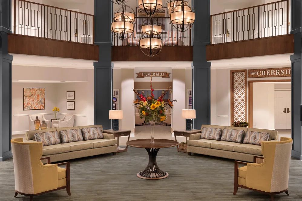 A modern lobby with elegant lighting and comfortable seating.