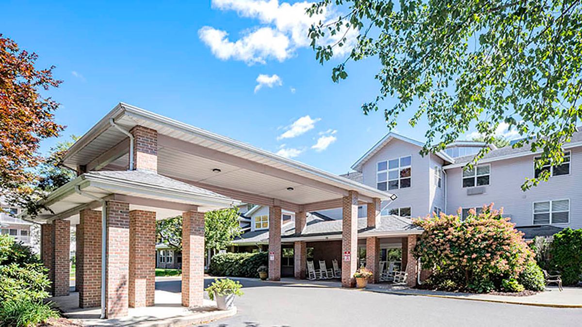 Front entrance of a residential building with a clear sky.