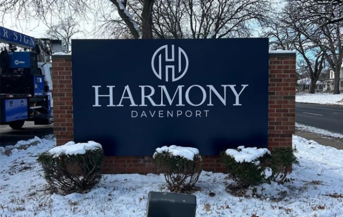 Sign for Harmony Davenport displayed outdoors in a snowy setting.