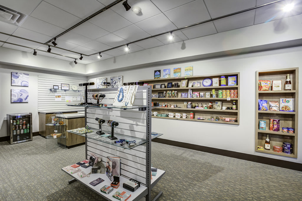 Interior view of a shop with shelves displaying various merchandise.