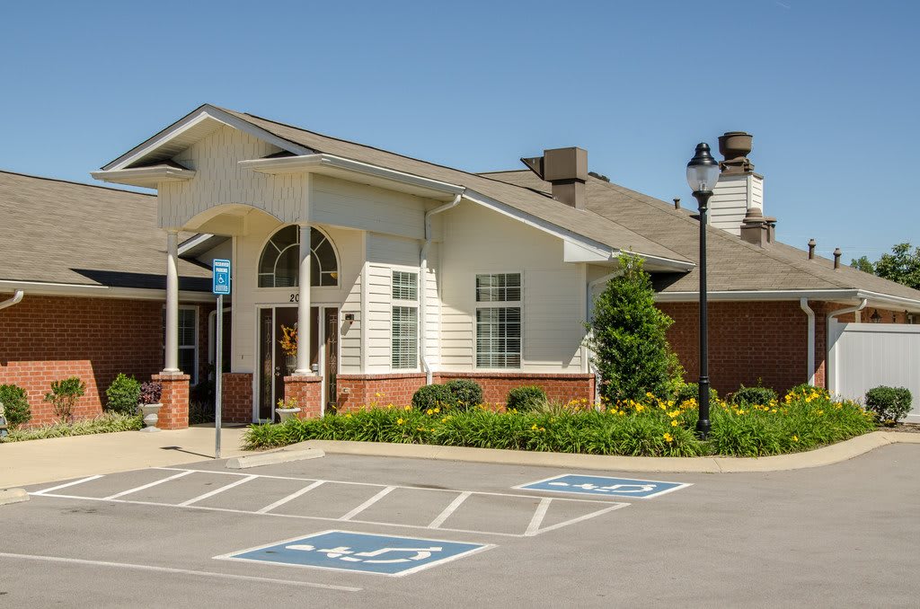 A building with a well-maintained facade and dedicated handicap parking spaces in front.