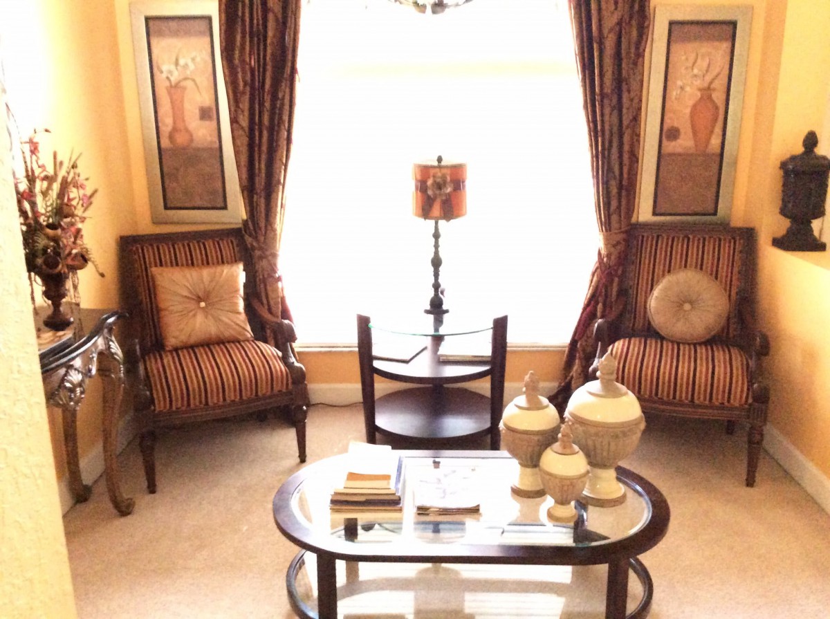 A cozy living room with elegant decor and furniture.