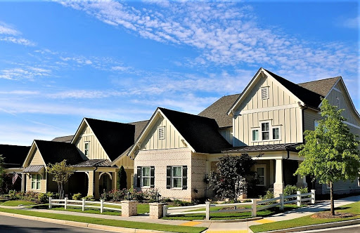 A charming suburban home under a clear blue sky.