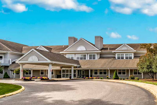 A welcoming residential building under a clear blue sky.