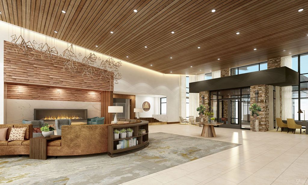 A modern lobby with a wooden ceiling and stylish reception area.