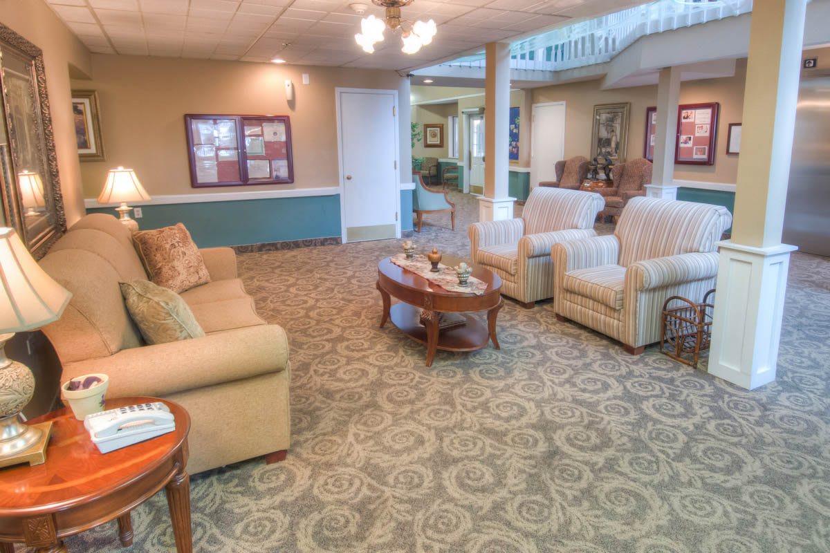 A cozy living room with comfortable seating and warm lighting.
