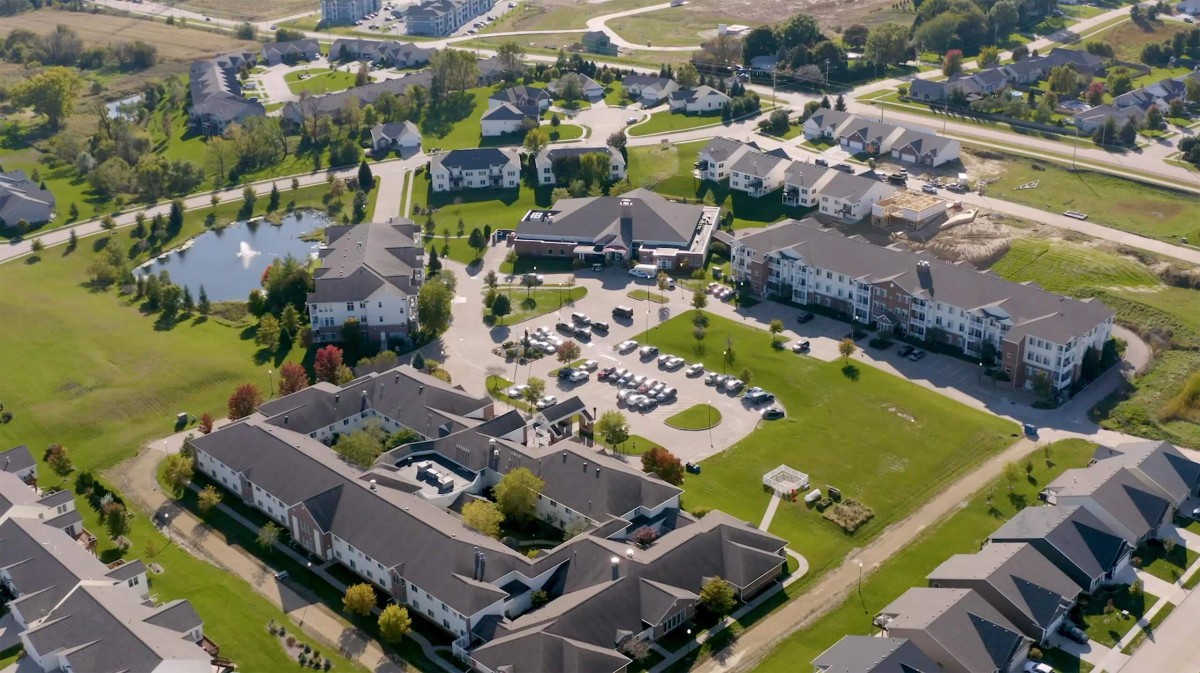 An aerial view of a residential neighborhood with multiple buildings and green spaces.