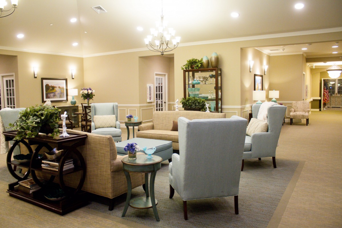 A cozy and elegantly designed living room with neutral-colored furniture and soft lighting.