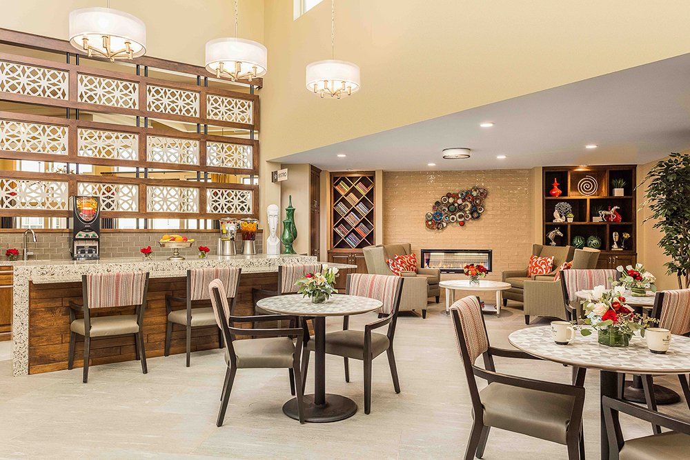 A modern lounge area with stylish furniture and elegant lighting.