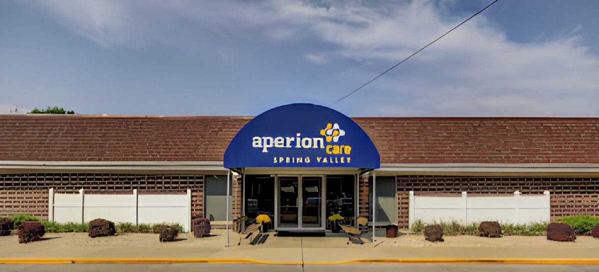 Entrance of Aperion Care Spring Valley with a blue awning.