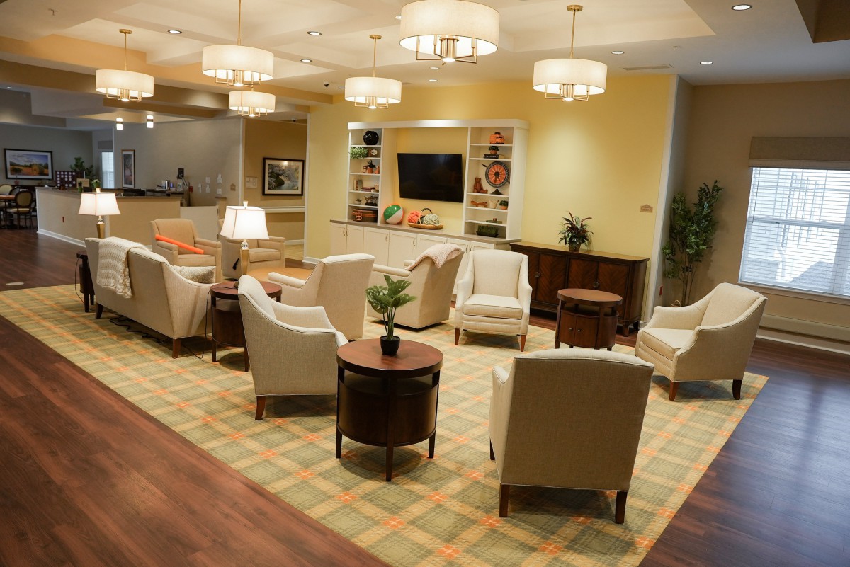 A cozy lobby with comfortable seating and warm lighting.
