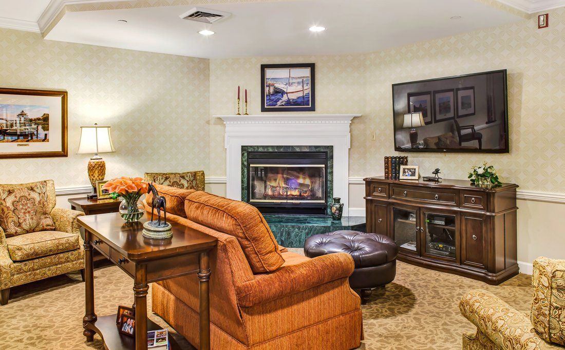 Cozy living room with a warm fireplace and comfortable seating.